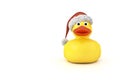 Yellow rubber ducky with a christmas hat Royalty Free Stock Photo