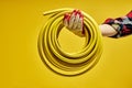 Yellow Rubber Fuel Hose on Yellow Background