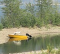 Yellow Run-about Boat on BC Beach Royalty Free Stock Photo