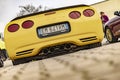 Yellow 90\'s Corvette Rear View Royalty Free Stock Photo