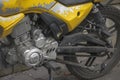 Yellow motorcycle engine and rear wheel