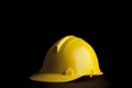 Yellow safety Engineer and Architect helmet on black background Royalty Free Stock Photo