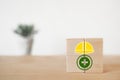 safety hat over green safety first icon on wooden cube block for awareness of safe for work concept