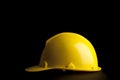 Yellow safety helmet on black background Royalty Free Stock Photo