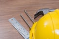 Yellow safety helmet and some tools