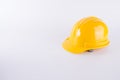 Yellow safety helmet on white background. Hard hat isolated on white. Safety equipment concept. Worker and Industrial theme Royalty Free Stock Photo