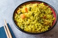 Yellow Saffron Basmati Rice with Turmeric and Vegetables Pilav or Pilaf in Bowl with Chopsticks. Royalty Free Stock Photo