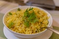 Yellow saffron rice with green garnish