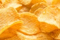 Yellow salted potato chips as background, closeup Royalty Free Stock Photo