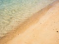 Yellow sand and clear blue ocean water Royalty Free Stock Photo
