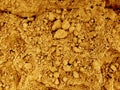 Yellow sand. Dry soil texture and background. The background of the red soil. Abstract land. Natural abstraction. Clay. The color Royalty Free Stock Photo