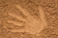 yellow sand, pattern of palm, trace of hand, hand impression, imprint of hand Royalty Free Stock Photo