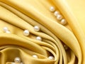 Yellow satin cloth with foldings Royalty Free Stock Photo