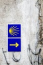 Yellow scallop shell and arrow signing the way to santiago de compostela in Galicia. Most famous pilgrimage route in Europe Royalty Free Stock Photo