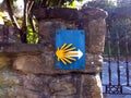 The yellow scallop shell signing the way to santiago de compostela on the Camino del Norte, Spain Royalty Free Stock Photo