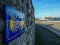 The yellow scallop shell signing the way to santiago de compostela on the Somo Royalty Free Stock Photo
