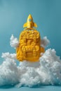 A yellow school backpack floats on white clouds with a yellow rocket on top against a blue background. Back to school Royalty Free Stock Photo