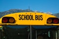 Yellow school bus blue sky closeup Royalty Free Stock Photo