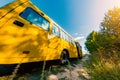 Yellow school bus on a country road Royalty Free Stock Photo