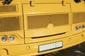 Yellow school bus. Details of school transport. Car headlights Royalty Free Stock Photo