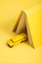 The Yellow School Bus Exits The Tunnel In The Form Of A Book Back To School. Concept Photo