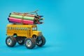 Yellow School bus and felt-tip pens on the roof, back to school concept, yellow background, copy space. education Royalty Free Stock Photo