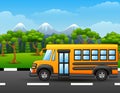 Yellow school bus on road with mountains and trees Royalty Free Stock Photo