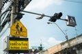 Yellow school zone warning sign at the roadside in Bangkok Royalty Free Stock Photo