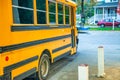 Yellow schoolbus parked along a city street, USA Royalty Free Stock Photo