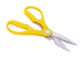 Yellow scissors on white background