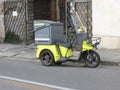 yellow scooter motorcycle of Poste Italiane in Pisa
