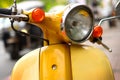 Yellow scooter on street Royalty Free Stock Photo