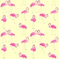 Yellow seamless summery wallpaper with pink lovely flamingo