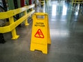 Yellow self standing wet floor warning sign Royalty Free Stock Photo