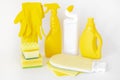 Yellow set of products for washing and cleaning. Rubber gloves, chemical bottles, sponges and rags. Royalty Free Stock Photo