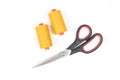 Yellow sewing thread coils with scissors on white background Royalty Free Stock Photo