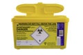 Yellow Sharpsguard biohazard medical contaminated sharps clinical waste container isolated on white background Royalty Free Stock Photo