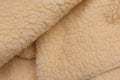 Yellow sheep material wool fur soft structure fleece fabric background texture warm natural nature skin Royalty Free Stock Photo