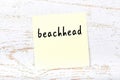 Yellow sheet of paper with word beachhead. Reminder concept Royalty Free Stock Photo