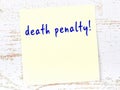 Yellow sheet of paper with word death penalty. Reminder concept Royalty Free Stock Photo