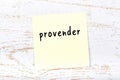 Yellow sheet of paper with word provender. Reminder concept Royalty Free Stock Photo