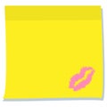 A yellow sheet of stickers with a lipstick imprint in the shape of lips. Template for records.