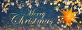 Yellow shining star and Christmas garlands on a blue abstract background Royalty Free Stock Photo