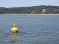 Yellow ship buoy floating