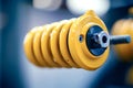 Close-up of yellow shock absorber showing its spring and mounting hardware Royalty Free Stock Photo