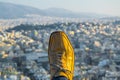 yellow shoe with athens in background on the Filopappos hill, Greece....IMAGE Royalty Free Stock Photo