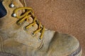 Yellow and shoe strap of old leather footware