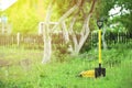 Yellow shovel and hose pipe Royalty Free Stock Photo