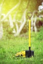 Yellow shovel and hose pipe Royalty Free Stock Photo