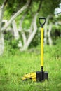 Yellow shovel and hose pipe Royalty Free Stock Photo